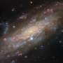 Hubble reveals spiral galaxy 53 million light-years away in striking detail