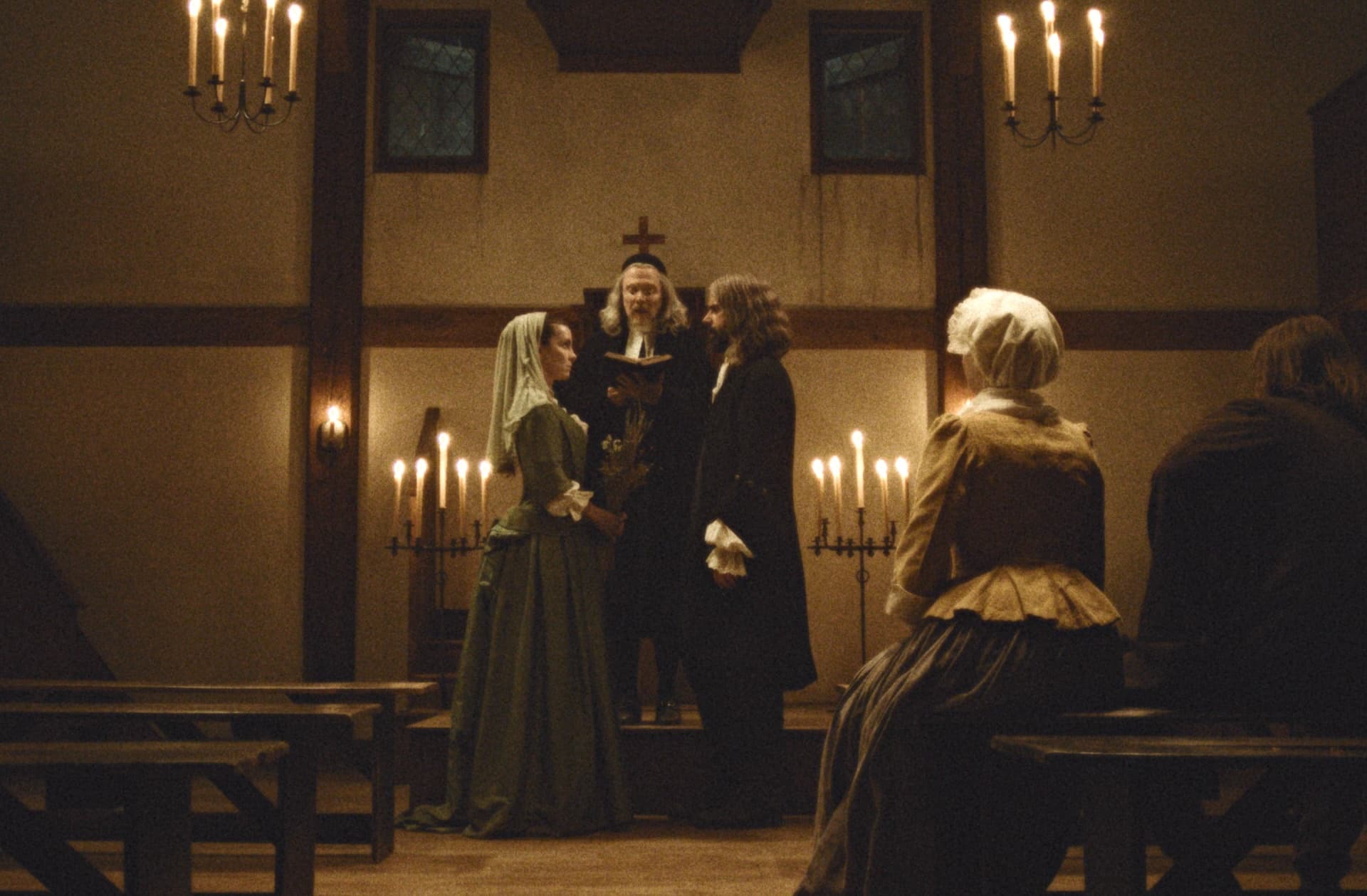 Inside the ‘Widow’s Bay’ Flashback to 1702: How Betty Gilpin and Hamish Linklater Reveal the Town’s Evil Origins
