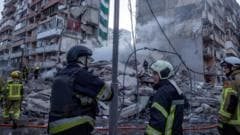 Rescuers search rubble of Kyiv flats after massive Russian strikes kill two