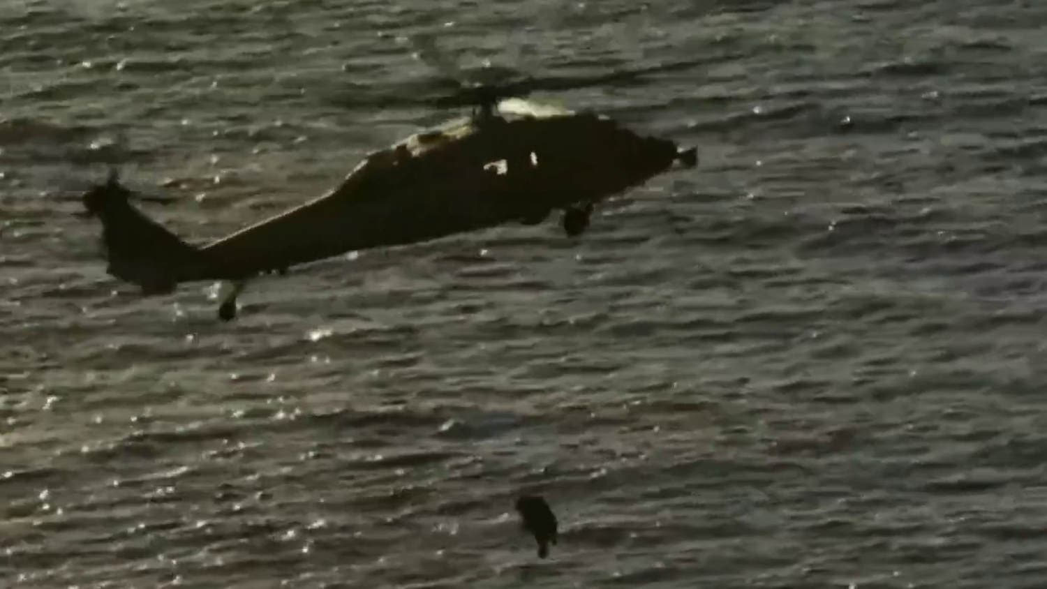 Astronauts hoisted by helicopter from splashdown site