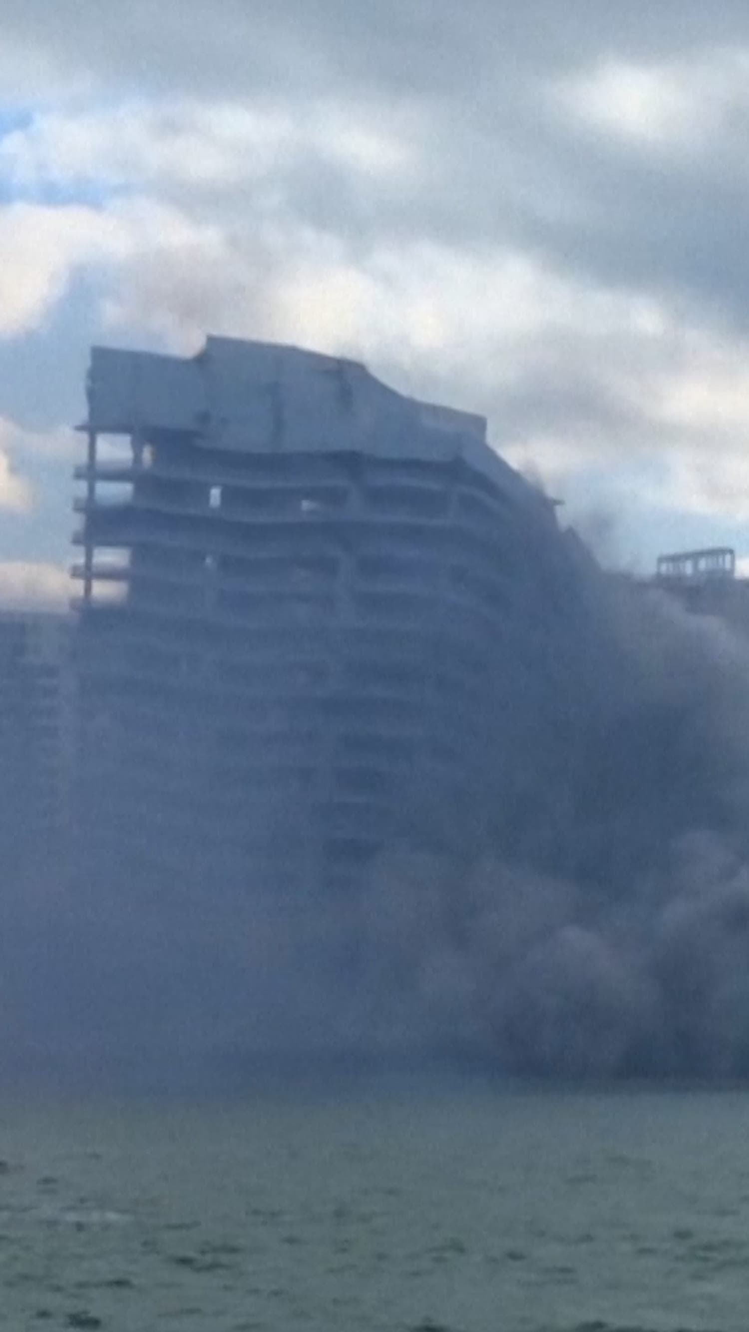 Controlled demolition takes down Miami hotel in seconds