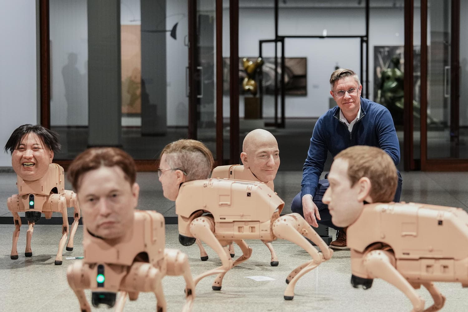 Robot dogs with Musk and Zuckerberg heads roam around Berlin museum in new exhibit