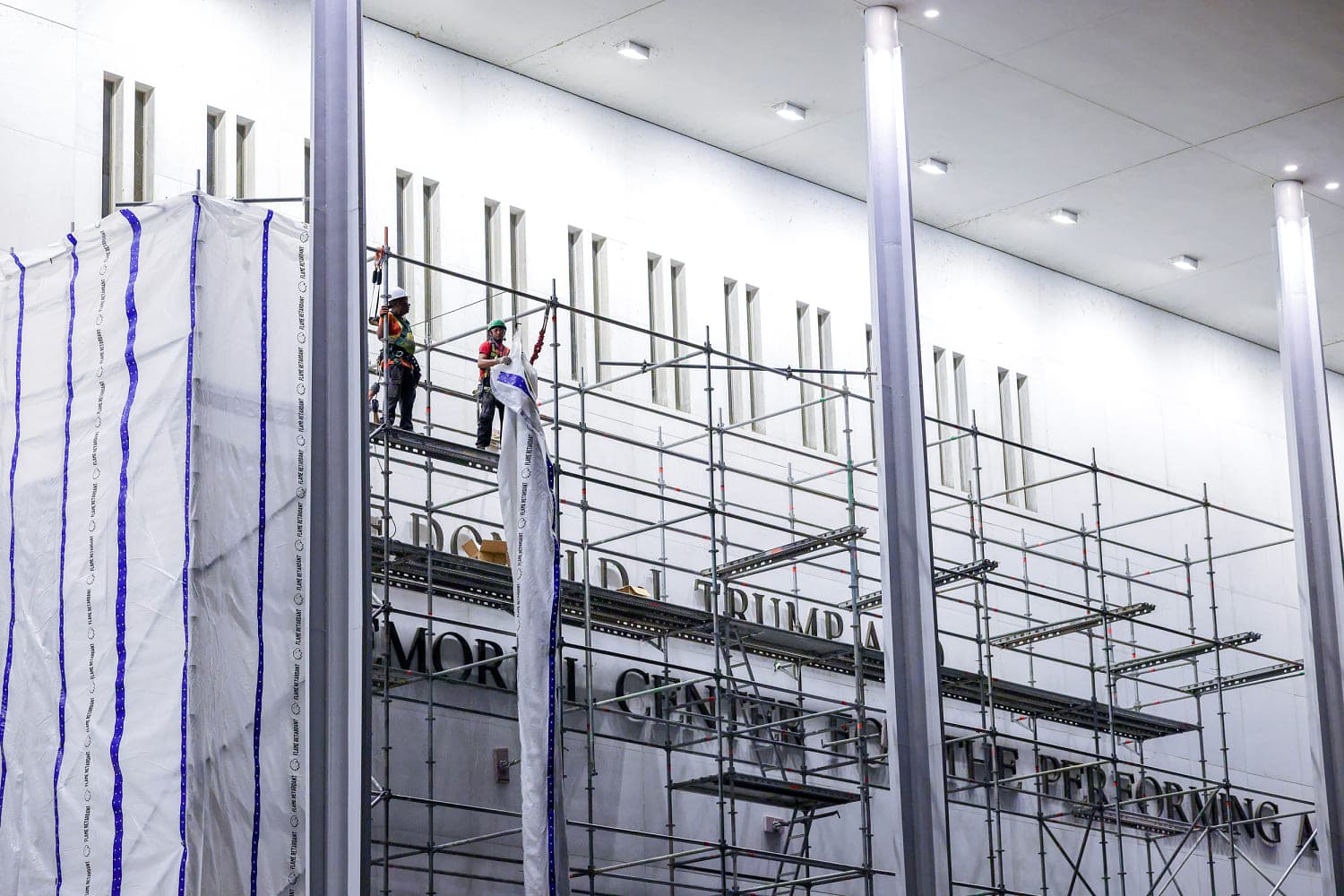 Construction workers begin removing Trump’s name from the Kennedy Center