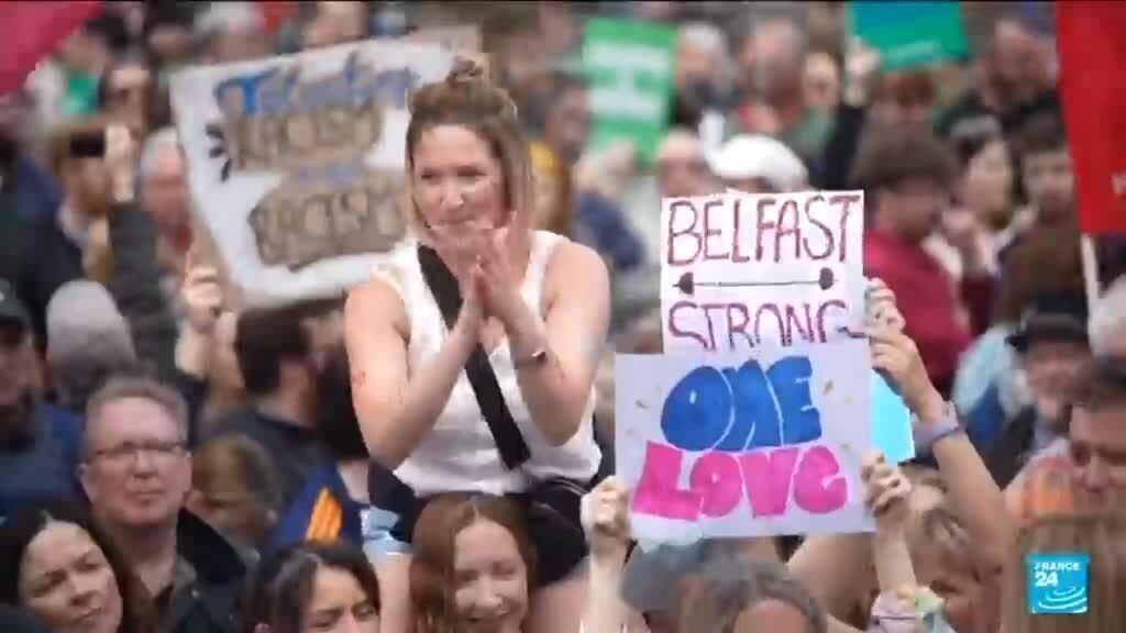 Thousands rally in Belfast to condemn anti-immigrant rioting that followed stabbing
