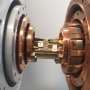 Quantum teleportation carries microwave states at temperatures up to 4 K, beating classical limit
