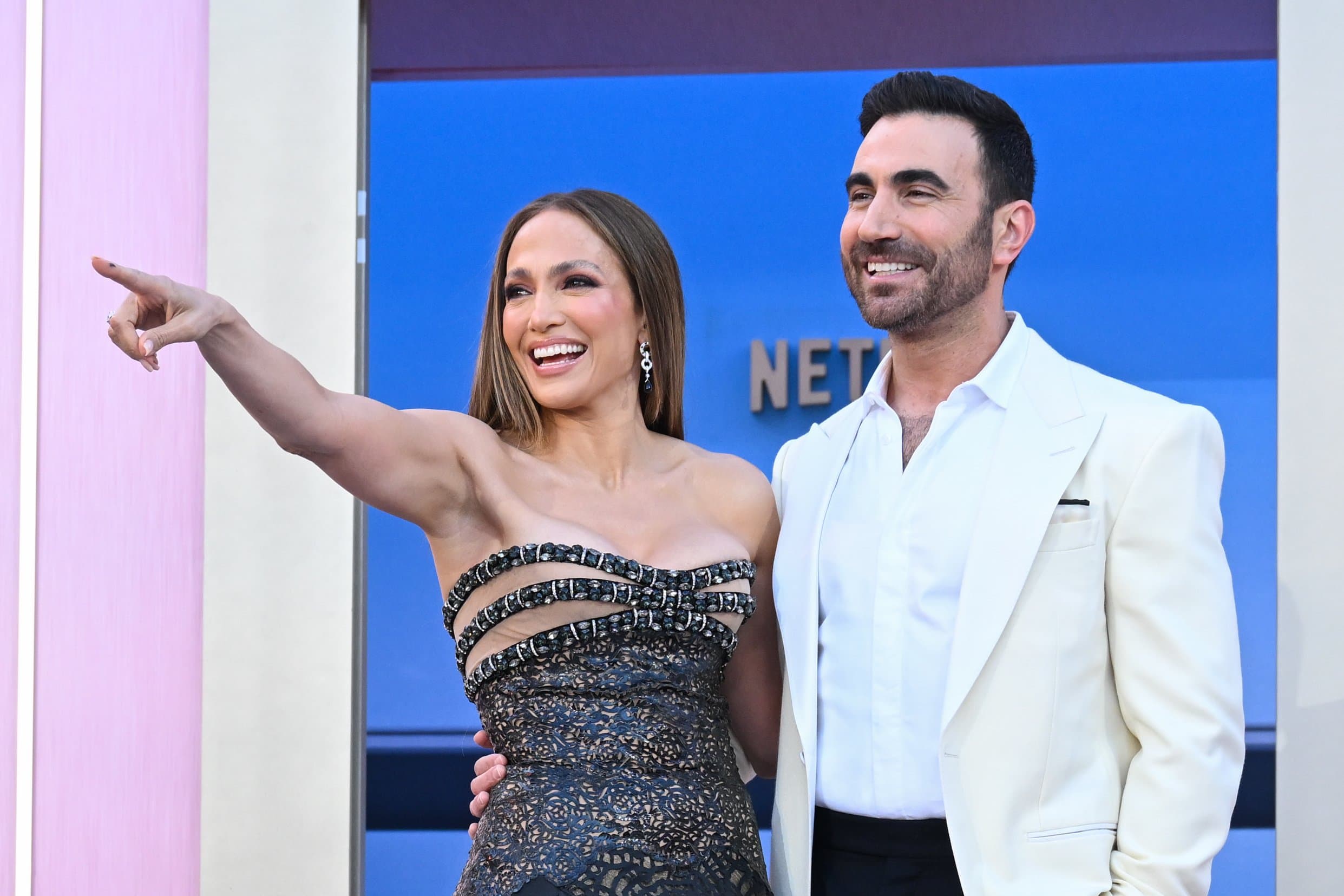 Jennifer Lopez on Meeting ‘Office Romance’ Co-Star Brett Goldstein for the First Time and That Viral ‘Off Campus’ Video: ‘The Show Is So Cute and I Love It’